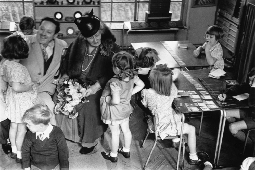 2nd November 1946: The founder of the Montessori Schools, Maria Montessori (1870-1952) in a classroom in Acton, London with a group of children. Original Publication: Picture Post - 4244 - The Woman Who Made School Fun - pub. 1946 (Photo by Kurt Hutton/Picture Post/Getty Images)